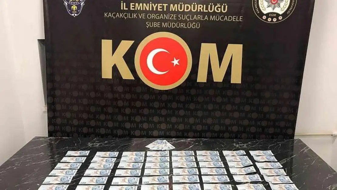 Kütahya'da piyasaya sahte para süren iki kişi yakalandı